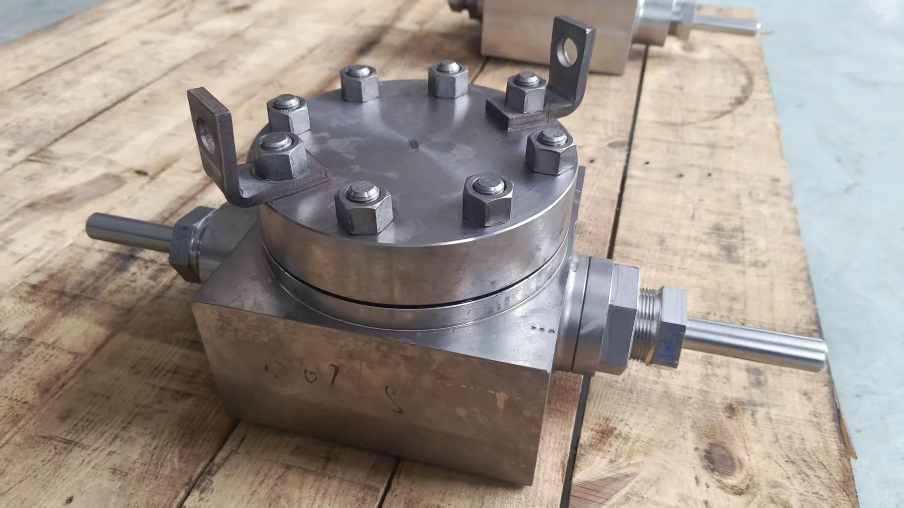 compact DBB valve block photographed in workshop
