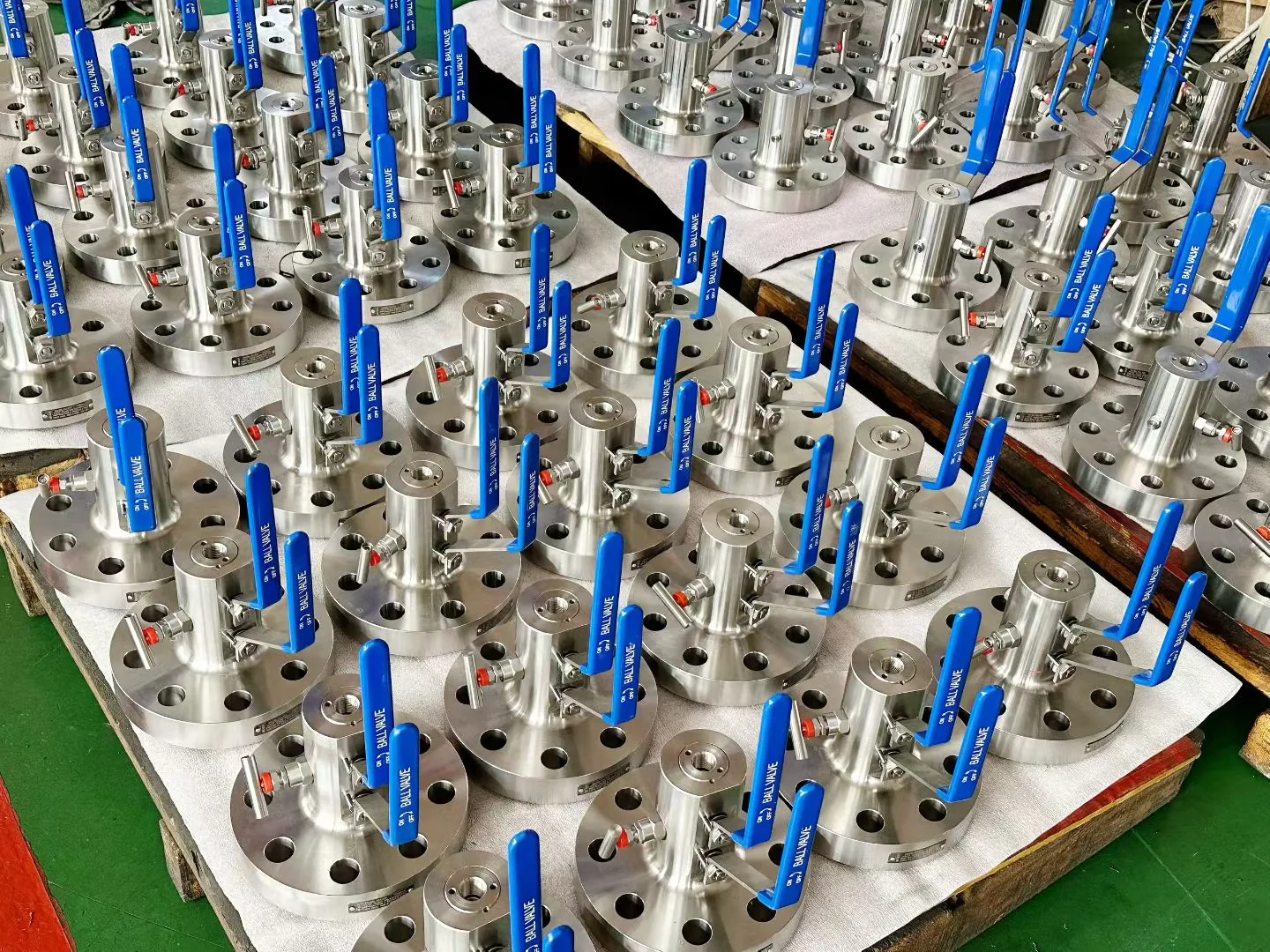 Batch of small flanged ball valves with lever handles.